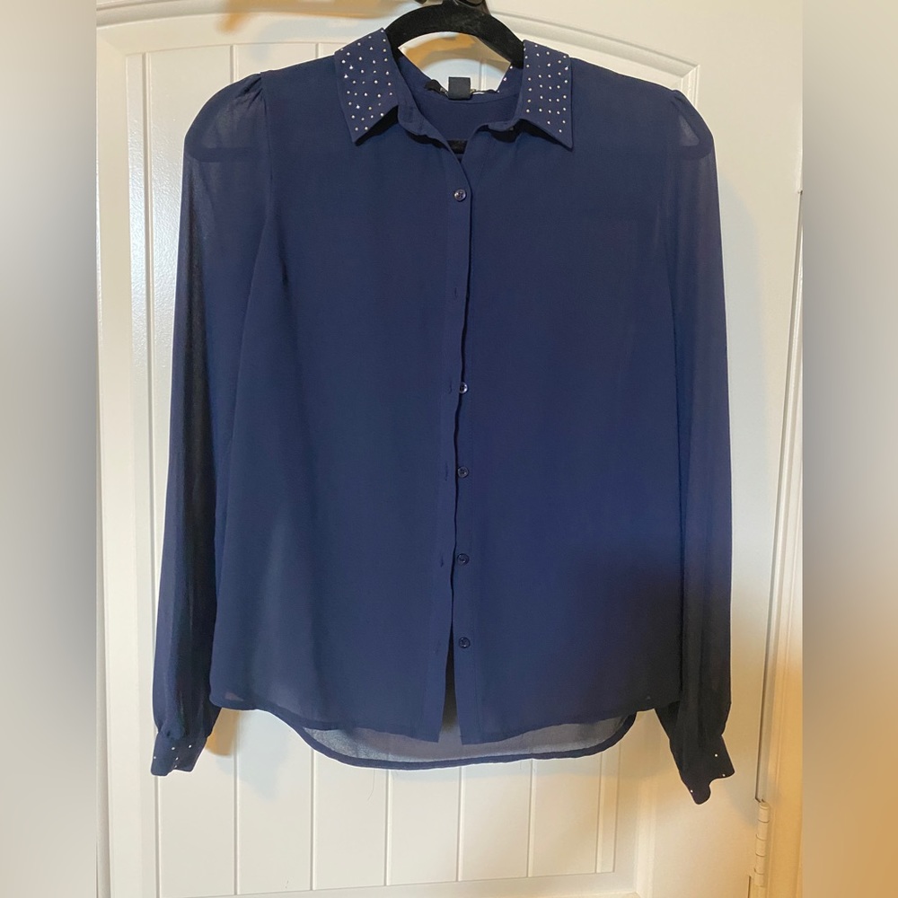 Sheer button up blouse.